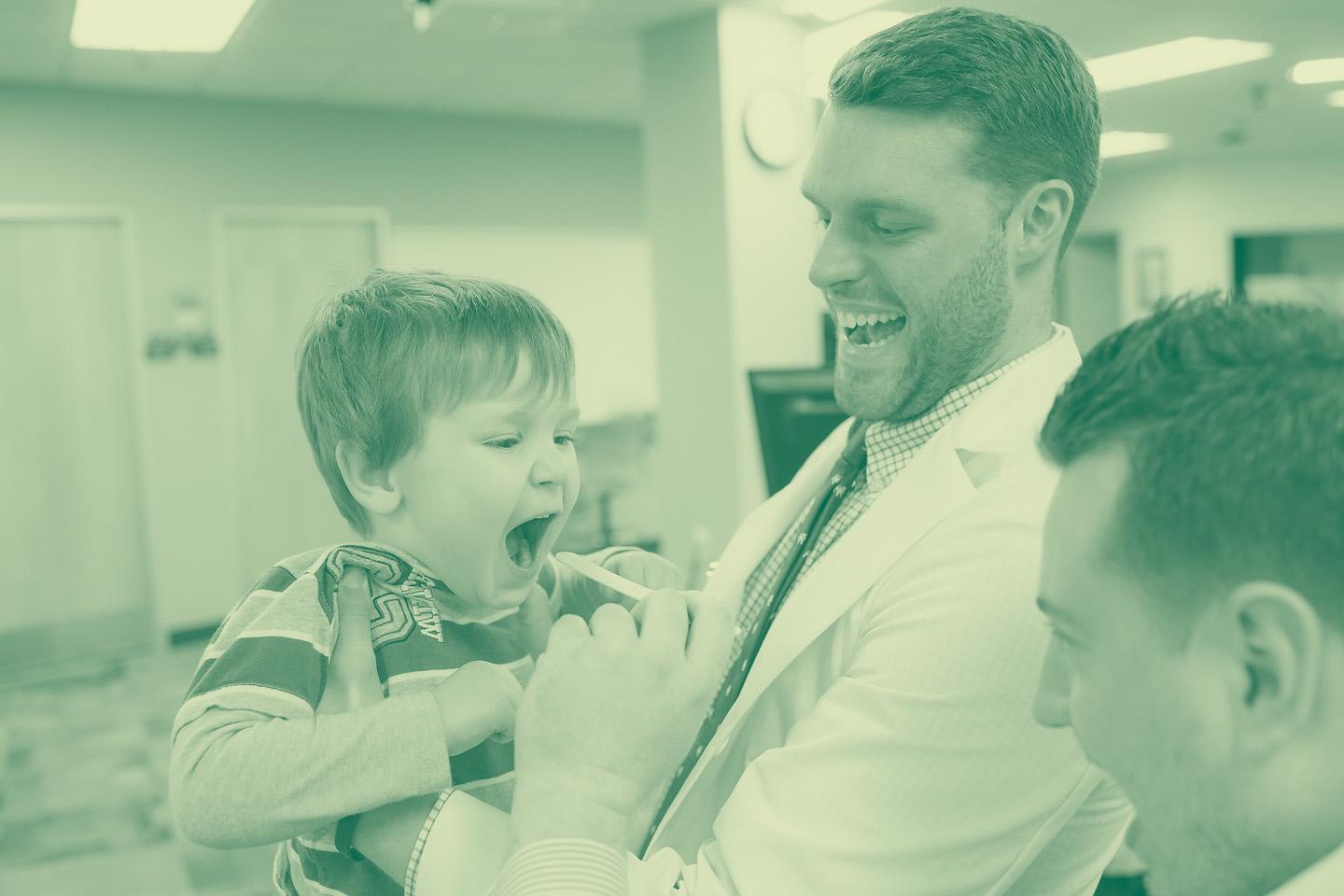 Medicine students work with boy patient